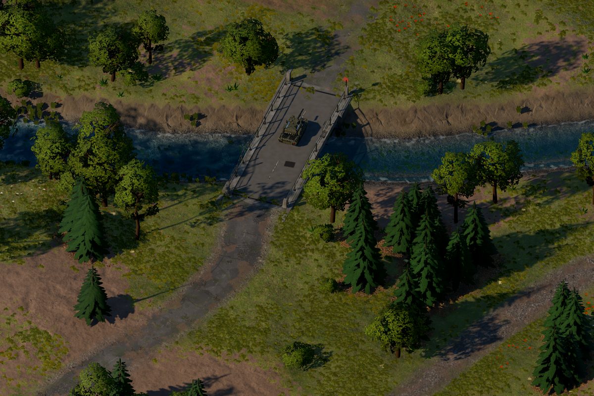 Alte Betonbrücke über den eingeschnittenen Fluss, ein Panther-Panzer fährt darüber, die Asphaltstraße führt zur Brücke.